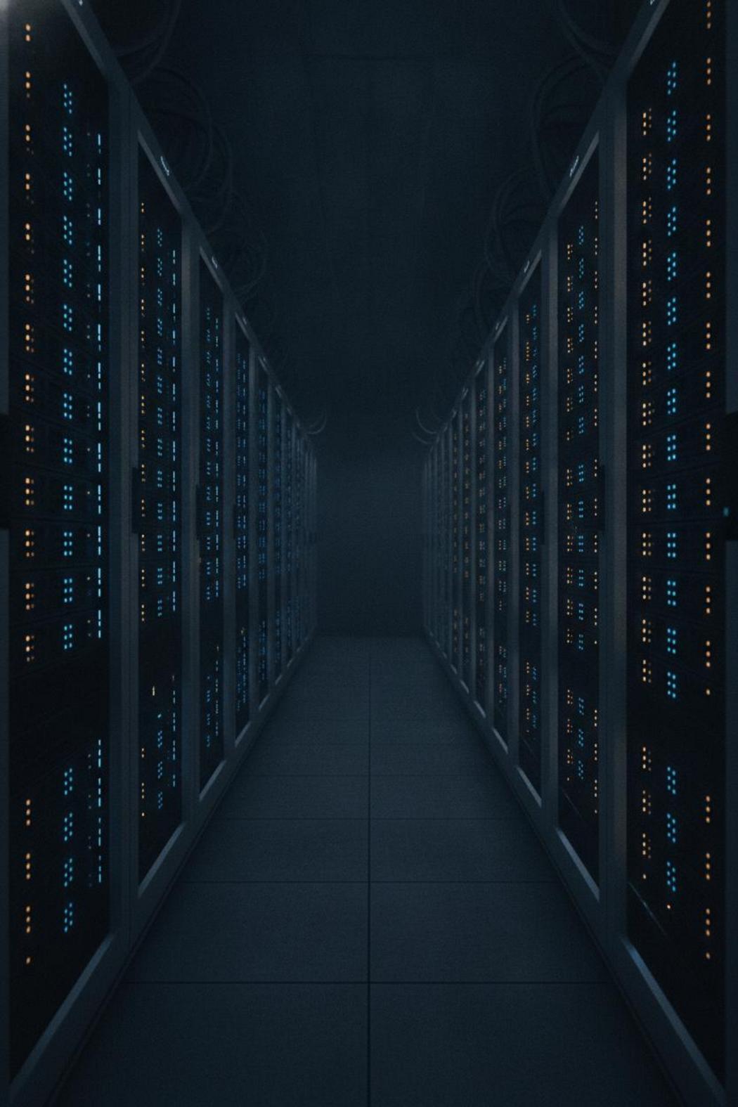 Server rack in dark data center corridor with blue and amber indicator lights, representing best AI agent products released this week